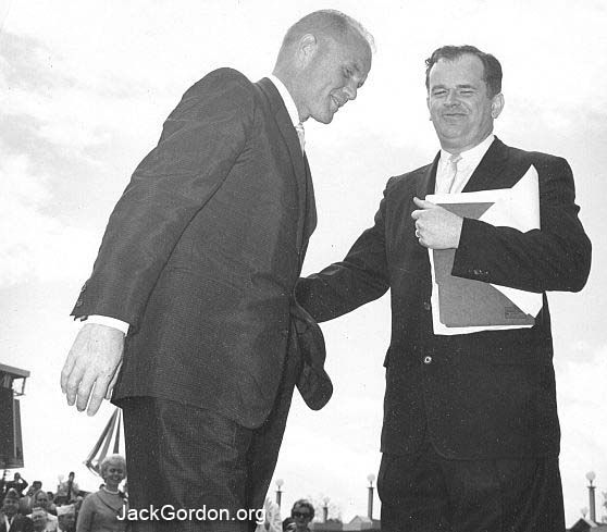A smiling Plaza of the States Coordinator Jack Gordon welcomes John Glenn to World's Fair, Seattle