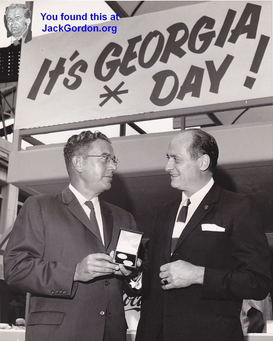 Georgia Governor Vandiver and host Gov. Albert D. Rosellini admire some Century 21 Trade Dollars