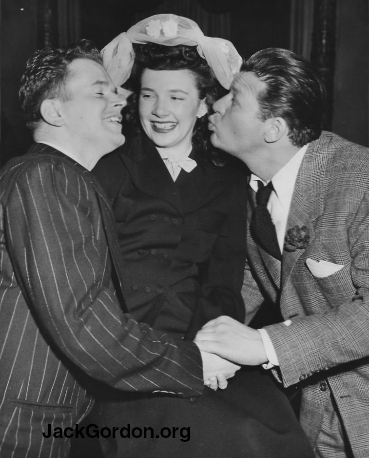 Jack Gordon and Jack Carson getting ready to kiss Roberta Gordon in the late 1940s